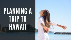 planning a trip to hawaii, header (girl enjoying herself on a beach in hawaii with diamond head in the background)